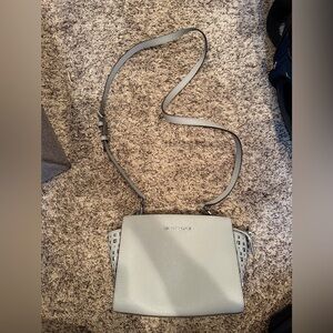 Michael kors crossbody bag in gray.